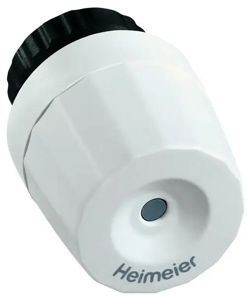 Thermischer Stellantrieb in Weiß mit schwarzer Einstellknopf-Oberfläche, angebauter Auslöserfunktion, hergestellt von IMI Hydronic Engineering.